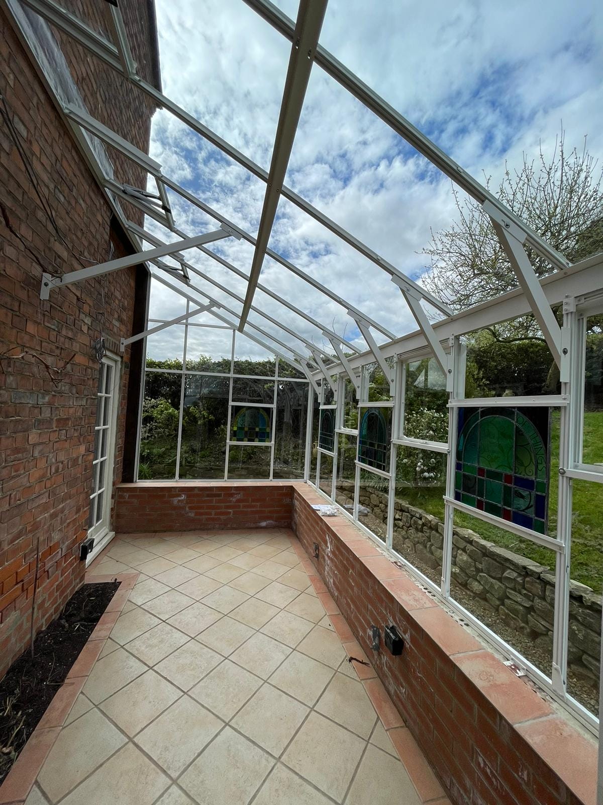 A bespoke Lean-To greenhouse to replace a tired timber one.. Dovetail Greenhouses